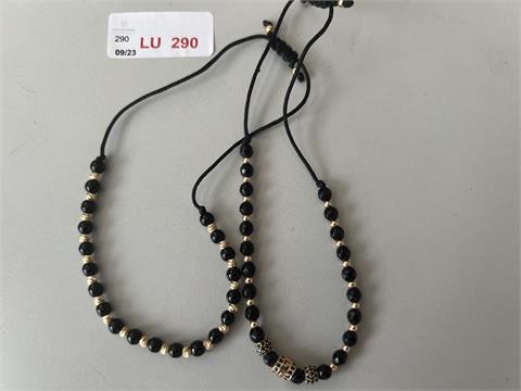 1 Armband m. schwarzen Perlen u. GG (585/- 4,95 gr.);
